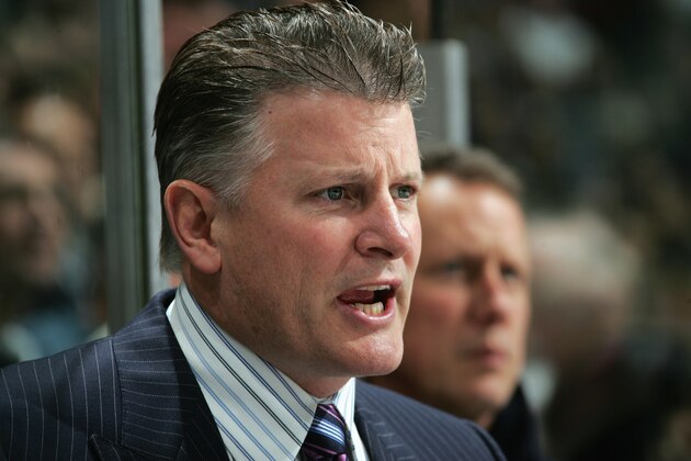 VANCOUVER, CANADA - OCTOBER 18:  Head Coach Marc Crawford of the Vancouver Canucks speaks from the bench during their NHL game against the Chicago Blackhawks  at General Motors Place on October 18, 2005 in Vancouver, British Columbia, Canada. The Canucks defeated the Blackhawks 6-2.   (Photo by Jeff Vinnick/Getty Images)