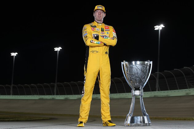 HOMESTEAD, FLORIDA - NOVEMBER 17: Kyle Busch, driver of the #18 M&M's Toyota poses with the trophy after winning the Monster Energy NASCAR Cup Series Championship at Homestead Speedway on November 17, 2019 in Homestead, Florida. (Photo by Chris Graythen/Getty Images)