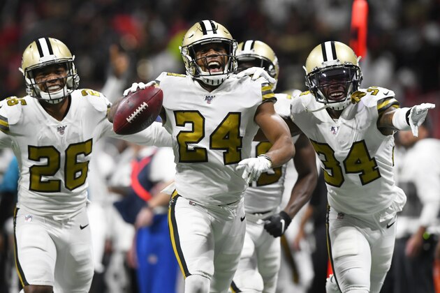 New Orleans Saints strong safety Vonn Bell (24) celebrates with teammates after his interception against the Atlanta Falcons during the second half of an NFL football game, Thursday, Nov. 28, 2019, in Atlanta. (AP Photo/John Amis)