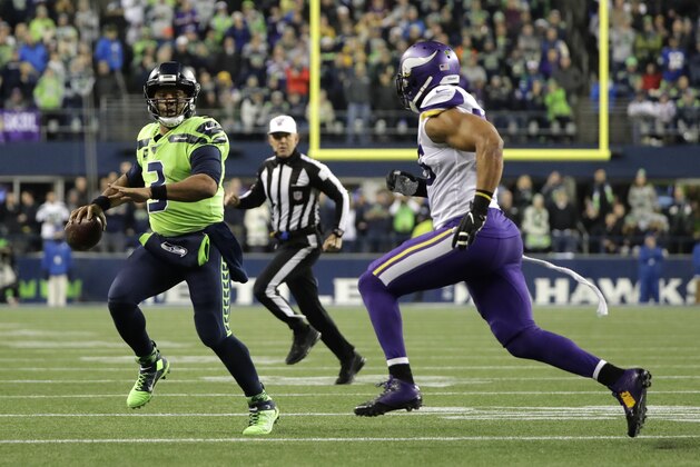 Seattle Seahawks quarterback Russell Wilson (3) scrambles as Minnesota Vikings' Anthony Barr approaches during the first half of an NFL football game, Monday, Dec. 2, 2019, in Seattle. (AP Photo/Ted S. Warren) Seattle Seahawks quarterback Russell Wilson (3) scrambles as Minnesota Vikings' Anthony Barr approaches during the first half of an NFL football game, Monday, Dec. 2, 2019, in Seattle. (AP Photo/Ted S. Warren)