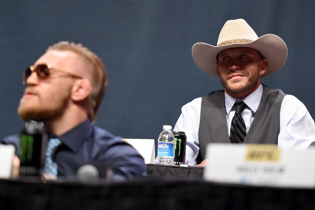 LAS VEGAS, NEVADA - SEPTEMBER 04:  (R-L) UFC lightweight title challenger Donald 'Cowboy' Cerrone exchanges words with UFC interim featherweight champion Conor McGregor during the UFC's Go Big launch event inside MGM Grand Garden Arena on September 4, 2015 in Las Vegas, Nevada. (Photo by Jeff Bottari/Zuffa LLC/Zuffa LLC via Getty Images)