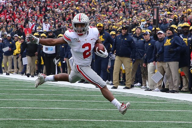 ANN ARBOR, MI - NOVEMBER 30: J.K. Dobbins #2 of the Ohio State Buckeyes runs for a first down during the first quarter of the game against the Michigan Wolverines at Michigan Stadium on November 30, 2019 in Ann Arbor, Michigan. (Photo by Leon Halip/Getty Images) ANN ARBOR, MI - NOVEMBER 30: J.K. Dobbins #2 of the Ohio State Buckeyes runs for a first down during the first quarter of the game against the Michigan Wolverines at Michigan Stadium on November 30, 2019 in Ann Arbor, Michigan. (Photo by Leon Halip/Getty Images)