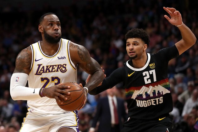 DENVER, COLORADO - DECEMBER 03: Lebron James #23 of the Los Angeles Lakers drives against Jamal Murray #27 of the Denver Nuggets in the first quarter at Pepsi Center on December 03, 2019 in Denver, Colorado. NOTE TO USER: User expressly acknowledges and agrees that, by downloading and or using this photograph, User is consenting to the terms and conditions of the Getty Images License Agreement. (Photo by Matthew Stockman/Getty Images)