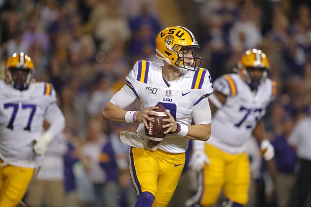 LSU quarterback Joe Burrow (9) scrambles in the first half of an NCAA college football game against Texas A&M in Baton Rouge, La., Saturday, Nov. 30, 2019. (AP Photo/Gerald Herbert)