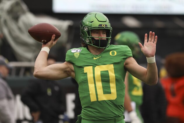 Oregon quarterback Justin Herbert (10) warms up prior to the start of an NCAA college football game against Oregon State in Eugene, Ore., Saturday, Nov. 30, 2019. Oregon won 24-10. (AP Photo/Amanda Loman)