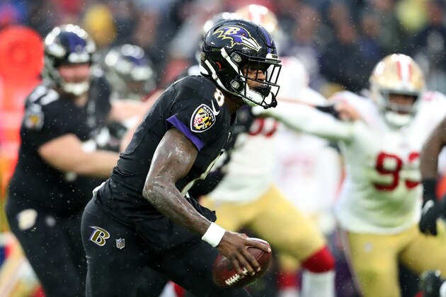 BALTIMORE, MARYLAND - DECEMBER 01: Quarterback Lamar Jackson #8 of the Baltimore Ravens runs with the ball against the San Francisco 49ers in the first half at M&T Bank Stadium on December 01, 2019 in Baltimore, Maryland. (Photo by Rob Carr/Getty Images)