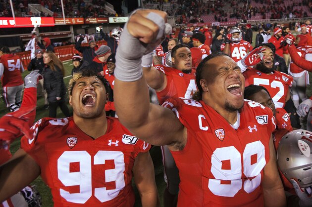 SALT LAKE CITY, UT - NOVEMBER 30: Leki Fotu #99 and Markgraf Keegan #93 of the Utah Utes celebrate their win over the Colorado Buffaloes at Rice-Eccles Stadium on November 30, 2019 in Salt Lake City, Utah. (Photo by Chris Gardner/Getty Images)