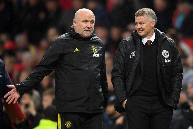 MANCHESTER, ENGLAND - SEPTEMBER 30:   Mike Phelan, assistant manager speaks with Ole Gunnar Solskjaer, Manager of Manchester United as they walk off the pitch at half time during the Premier League match between Manchester United and Arsenal FC at Old Trafford on September 30, 2019 in Manchester, United Kingdom. (Photo by Michael Regan/Getty Images)
