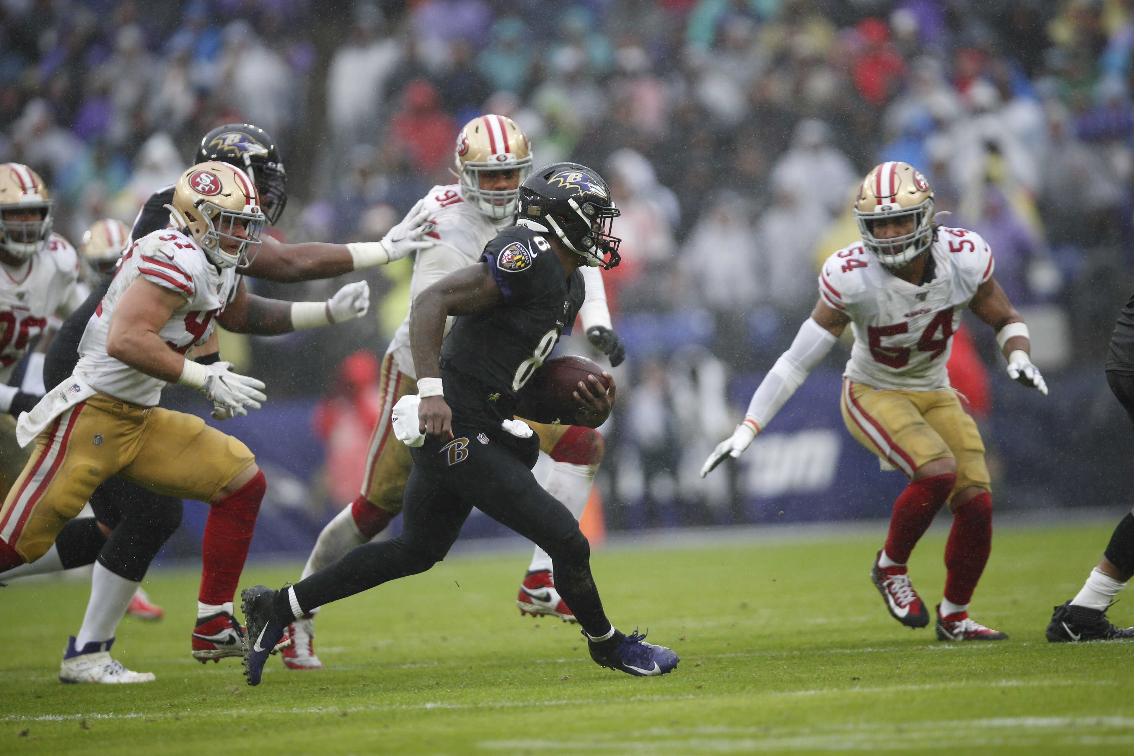 BALTIMORE, MD - DECEMBER 1: Lamar Jackson #8 of the Baltimore Ravens rushes during the game against the San Francisco 49ers at M&T Bank Stadium on December 1, 2019 in Baltimore, Maryland. The Ravens defeated the 49ers 20-17. (Photo by Michael Zagaris/San Francisco 49ers/Getty Images) BALTIMORE, MD - DECEMBER 1: Lamar Jackson #8 of the Baltimore Ravens rushes during the game against the San Francisco 49ers at M&T Bank Stadium on December 1, 2019 in Baltimore, Maryland. The Ravens defeated the 49ers 20-17. (Photo by Michael Zagaris/San Francisco 49ers/Getty Images)
