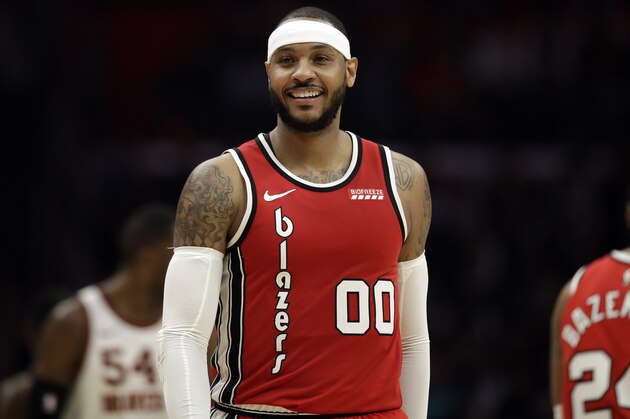 Portland Trail Blazers' Carmelo Anthony (00) smiles during the second half of an NBA basketball game against the Los Angeles Clippers Tuesday, Dec. 3, 2019, in Los Angeles. (AP Photo/Marcio Jose Sanchez)