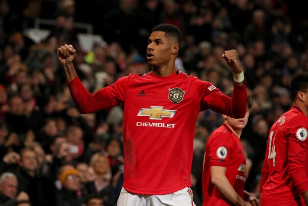 MANCHESTER, ENGLAND - DECEMBER 04: Marcus Rashford of Manchester United celebrates after scoring a goal to make it 2-1 during the Premier League match between Manchester United and Tottenham Hotspur at Old Trafford on December 4, 2019 in Manchester, United Kingdom. (Photo by Matthew Ashton - AMA/Getty Images)
