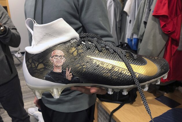 This photo shows Detroit Lions quarterback David Blough's special shoes that honors Tyler Trent, Wednesday, Dec. 4, 2019 in Allen Park, Mich. Blough, now a quarterback for the Detroit Lions, showed off a special shoe with Trent's likeness on it. Trent was the inspirational Purdue fan who died of bone cancer at age 20 on Jan. 1. Blough, who played at Purdue, said he's planning to wear the shoes in Detroit's game at Minnesota this weekend. (AP Photo/Noah Trister)