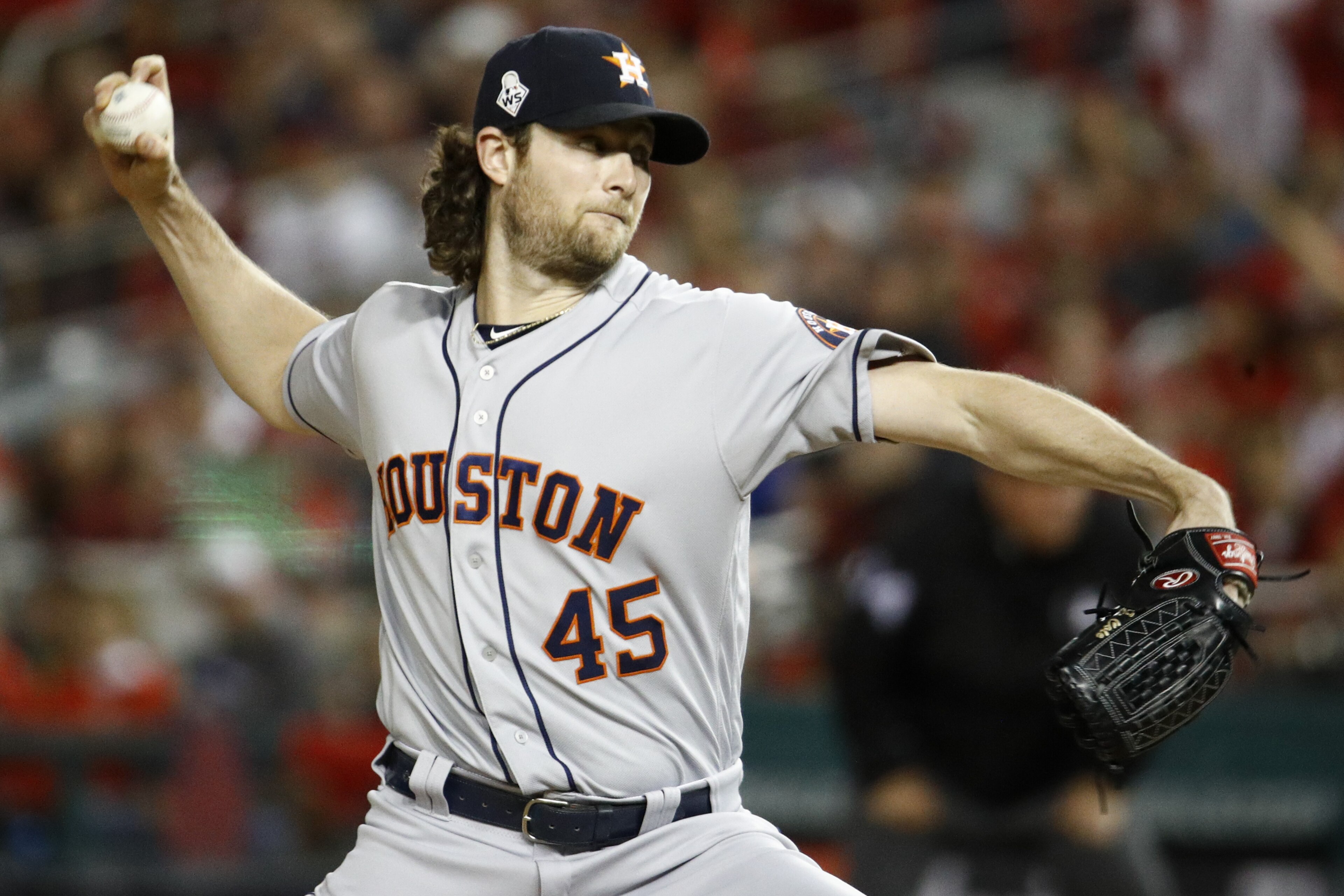 FILE - In this Oct. 27, 2019, file photo, Houston Astros starting pitcher Gerrit Cole throws against the Washington Nationals during the first inning of Game 5 of the baseball World Series in Washington. Gerrit Cole, the top pitcher on the free-agent market, was to meet with New York Yankees officials in California on Tuesday, Dec. 3, 2019. General manager Brian Cashman, manager Aaron Boone and new Yankees pitching coach Matt Blake made the trip to speak with the 29-year-old right-hander, a person familiar with the planning said. The person spoke to The Associated Press on condition of anonymity because the meeting was not announced.(AP Photo/Patrick Semansky, File)