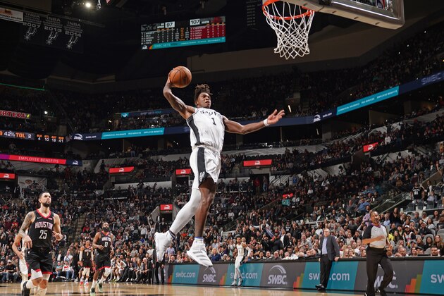 SAN ANTONIO, TX - DECEMBER 3: Lonnie Walker IV #1 of the San Antonio Spurs dunks the ball against the Houston Rockets on December 3, 2019 at the AT&T Center in San Antonio, Texas. NOTE TO USER: User expressly acknowledges and agrees that, by downloading and or using this photograph, user is consenting to the terms and conditions of the Getty Images License Agreement. Mandatory Copyright Notice: Copyright 2019 NBAE (Photos by Darren Carroll/NBAE via Getty Images)