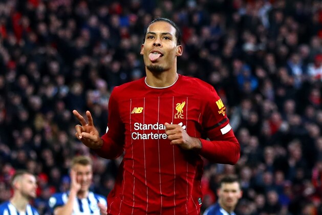 LIVERPOOL, ENGLAND - NOVEMBER 30: Virgil Van Dijk of Liverpool celebrates scoring his teams second goal during the Premier League match between Liverpool FC and Brighton & Hove Albion at Anfield on November 30, 2019 in Liverpool, United Kingdom. (Photo by Chloe Knott - Danehouse/Getty Images)