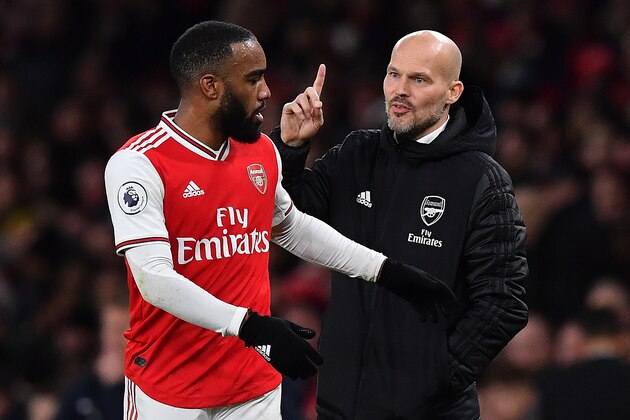 Arsenal's Swedish Interim head coach Freddie Ljungberg (R) gestures towards Arsenal's French striker Alexandre Lacazette during the English Premier League football match between Arsenal and Brighton and Hove Albion at the Emirates Stadium in London on December 5, 2019. (Photo by Ben STANSALL / AFP) / RESTRICTED TO EDITORIAL USE. No use with unauthorized audio, video, data, fixture lists, club/league logos or 'live' services. Online in-match use limited to 120 images. An additional 40 images may be used in extra time. No video emulation. Social media in-match use limited to 120 images. An additional 40 images may be used in extra time. No use in betting publications, games or single club/league/player publications. /  (Photo by BEN STANSALL/AFP via Getty Images)
