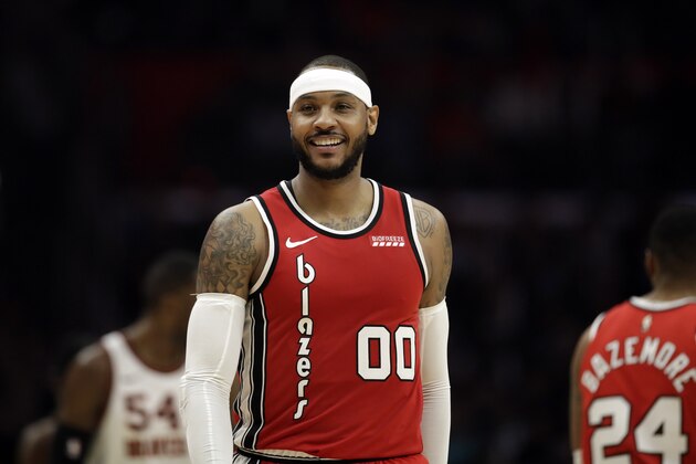 Portland Trail Blazers' Carmelo Anthony (00) smiles during the second half of an NBA basketball game against the Los Angeles Clippers Tuesday, Dec. 3, 2019, in Los Angeles. (AP Photo/Marcio Jose Sanchez)
