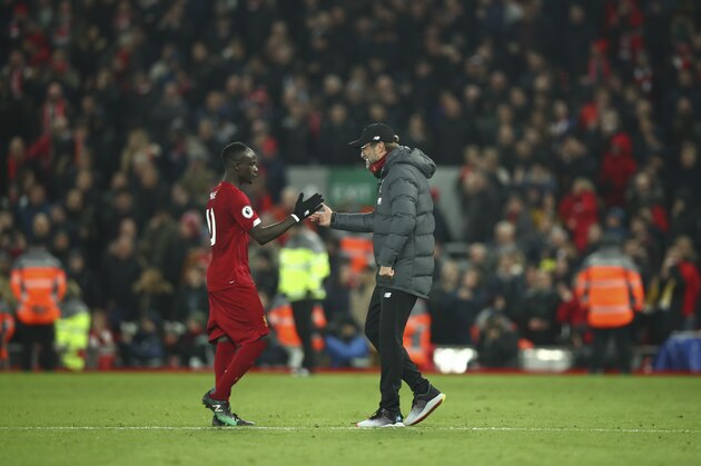 LIVERPOOL, ENGLAND - NOVEMBER 10: Sadio Mane of Liverpool and Jurgen Klopp the head coach / manager of Liverpool celebrate winning the match at full time after the Premier League match between Liverpool FC and Manchester City at Anfield on November 10, 2019 in Liverpool, United Kingdom. (Photo by Robbie Jay Barratt - AMA/Getty Images)
