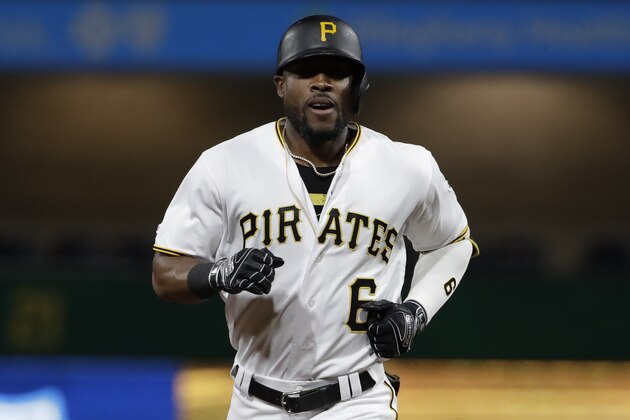Pittsburgh Pirates' Starling Marte rounds third after hitting a three-run home run off New York Mets relief pitcher Tyler Bashlor, right, during the seventh inning of a baseball game in Pittsburgh, Friday, Aug. 2, 2019. The Pirates won 8-4. (AP Photo/Gene J. Puskar)