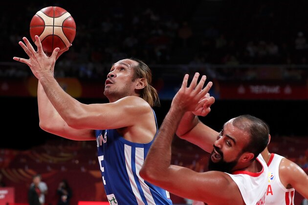 BEIJING, CHINA - SEPTEMBER 06: June Mar Fajardo #15 of the Philippines National Team in action against the Tunisia National Team during the classification round of 2019 FIBA World Cup on September 6, 2019 in Beijing, China. (Photo by Xinyu Cui/Getty Images)