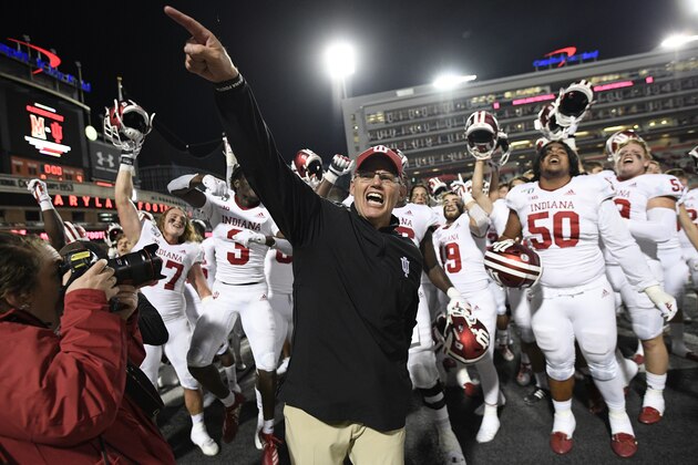 Indiana head coach Tom Allen, center, celebrates with his team after an NCAA college football game against Maryland, Saturday, Oct. 19, 2019, in College Park, Md. Indiana won 34-28. (AP Photo/Nick Wass)