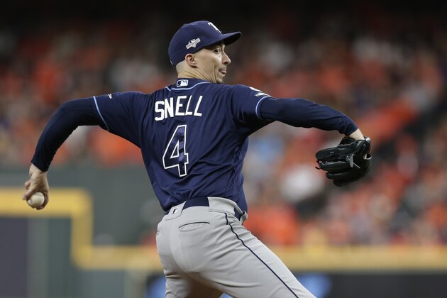 Tampa Bay Rays starting pitcher Blake Snell (4) pitches against the Houston Astros during the third inning of Game 5 of a baseball American League Division Series in Houston, Thursday, Oct. 10, 2019. (AP Photo/Michael Wyke)