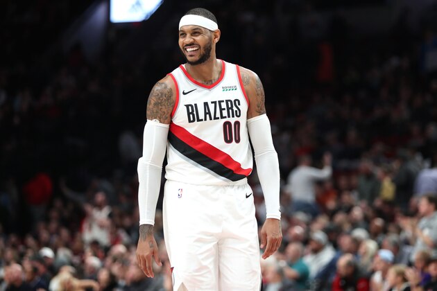 PORTLAND, OREGON - DECEMBER 04: Carmelo Anthony #00 of the Portland Trail Blazers smiles in the fourth quarter against the Sacramento Kings during their game at Moda Center on December 04, 2019 in Portland, Oregon. NOTE TO USER: User expressly acknowledges and agrees that, by downloading and or using this photograph, User is consenting to the terms and conditions of the Getty Images License Agreement (Photo by Abbie Parr/Getty Images)