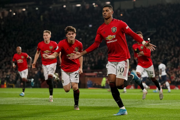 MANCHESTER, ENGLAND - DECEMBER 04: Marcus Rashford of Manchester United celebrates after scoring a goal to make it 2-1 during the Premier League match between Manchester United and Tottenham Hotspur at Old Trafford on December 4, 2019 in Manchester, United Kingdom. (Photo by Matthew Ashton - AMA/Getty Images)