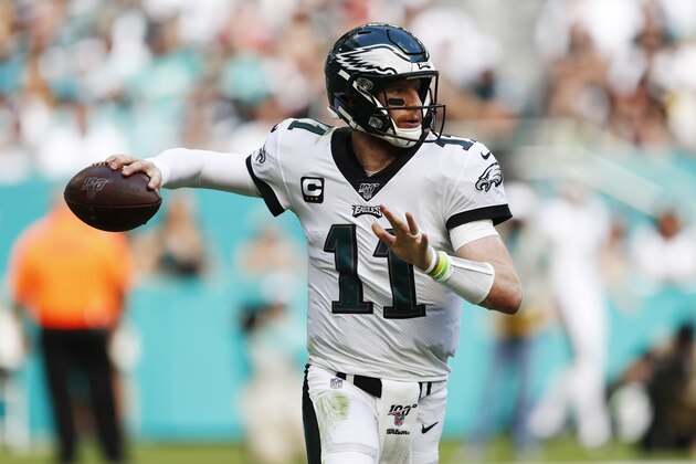Philadelphia Eagles quarterback Carson Wentz (11) looks to pass, during the first half at an NFL football game against the Miami Dolphins, Sunday, Dec. 1, 2019, in Miami Gardens, Fla. (AP Photo/Brynn Anderson)