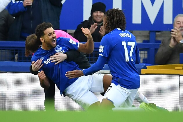 Everton's English striker Dominic Calvert-Lewin (2nd L) celebrates with teammates after scoring their second goal during the English Premier League football match between Everton and Chelsea at Goodison Park in Liverpool, north west England on December 7, 2019. (Photo by Paul ELLIS / AFP) / RESTRICTED TO EDITORIAL USE. No use with unauthorized audio, video, data, fixture lists, club/league logos or 'live' services. Online in-match use limited to 120 images. An additional 40 images may be used in extra time. No video emulation. Social media in-match use limited to 120 images. An additional 40 images may be used in extra time. No use in betting publications, games or single club/league/player publications. / (Photo by PAUL ELLIS/AFP via Getty Images) Everton's English striker Dominic Calvert-Lewin (2nd L) celebrates with teammates after scoring their second goal during the English Premier League football match between Everton and Chelsea at Goodison Park in Liverpool, north west England on December 7, 2019. (Photo by Paul ELLIS / AFP) / RESTRICTED TO EDITORIAL USE. No use with unauthorized audio, video, data, fixture lists, club/league logos or 'live' services. Online in-match use limited to 120 images. An additional 40 images may be used in extra time. No video emulation. Social media in-match use limited to 120 images. An additional 40 images may be used in extra time. No use in betting publications, games or single club/league/player publications. / (Photo by PAUL ELLIS/AFP via Getty Images)