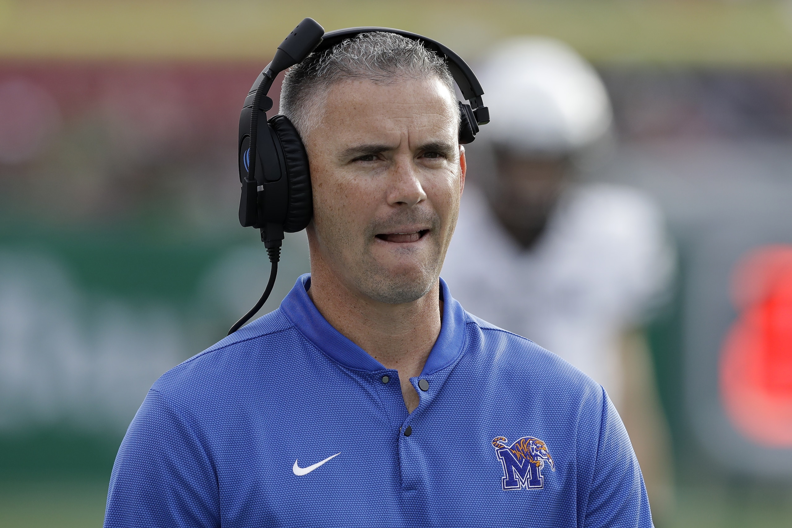 Memphis head coach Mike Norvell watches the action against South Florida during the first half of an NCAA college football game Saturday, Nov. 23, 2019, in Tampa, Fla. (AP Photo/Chris O'Meara)