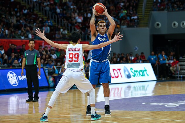 MANILA, PHILIPPINES - DECEMBER 07: Vic Manuel #4 of the Philippines shoots the ball against Phu Dwe Star #99 of Myanmar during the 5x5 Men's Basketball at the Mall of Asia Arena during day 7 of the Southeast Asian Games on December 07, 2019 in Manila, Philippines. (Photo by Annice Lyn/Getty Images)