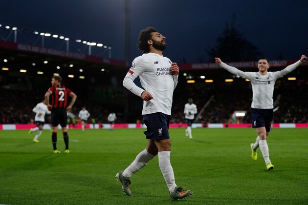 Liverpool's Egyptian midfielder Mohamed Salah celebrates scoring their third goal during the English Premier League football match between Bournemouth and Liverpool at the Vitality Stadium in Bournemouth, southern England on December 7, 2019. (Photo by Adrian DENNIS / AFP) / RESTRICTED TO EDITORIAL USE. No use with unauthorized audio, video, data, fixture lists, club/league logos or 'live' services. Online in-match use limited to 120 images. An additional 40 images may be used in extra time. No video emulation. Social media in-match use limited to 120 images. An additional 40 images may be used in extra time. No use in betting publications, games or single club/league/player publications. /  (Photo by ADRIAN DENNIS/AFP via Getty Images)