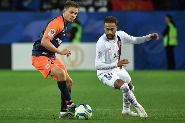 Paris Saint-Germain's Brazilian forward Neymar (R) and Montpellier's French defender Arnaud Souquet fight for the ball during the French L1 football match between Montpellier Herault Sport Club (MHSC) and Paris Saint-Germain (PSG) on December 7, 2019, at the Mosson stadium in Montpellier, southeastern France. (Photo by Pascal GUYOT / AFP) (Photo by PASCAL GUYOT/AFP via Getty Images)