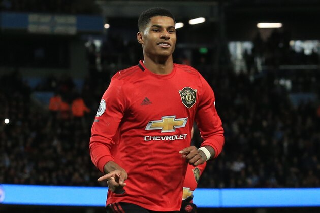 Manchester United's English striker Marcus Rashford celebrates scoring the opening goal from the penalty spot during the English Premier League football match between Manchester City and Manchester United at the Etihad Stadium in Manchester, north west England, on December 7, 2019. (Photo by Lindsey Parnaby / AFP) / RESTRICTED TO EDITORIAL USE. No use with unauthorized audio, video, data, fixture lists, club/league logos or 'live' services. Online in-match use limited to 120 images. An additional 40 images may be used in extra time. No video emulation. Social media in-match use limited to 120 images. An additional 40 images may be used in extra time. No use in betting publications, games or single club/league/player publications. /  (Photo by LINDSEY PARNABY/AFP via Getty Images)