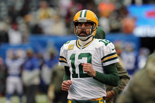 EAST RUTHERFORD, NEW JERSEY - DECEMBER 1: Quarterback Aaron Rodgers #12 of the Green Bay Packers enters the field against the New York Giants in the first half in the snow at MetLife Stadium on December 1, 2019 in East Rutherford, New Jersey. (Photo by Al Pereira/Getty Images)