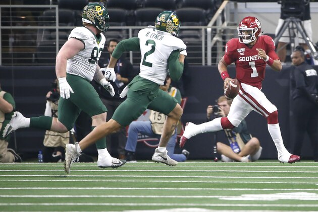 ARLINGTON, TX - DECEMBER 07: Jalen Hurts #1 of the Oklahoma Sooners scrambles with the ball as James Lynch #93 and Blake Lynch #2 of the Baylor Bears pursue in the second quarter of the Big 12 Football Championship at AT&T Stadium on December 7, 2019 in Arlington, Texas. (Photo by Ron Jenkins/Getty Images)