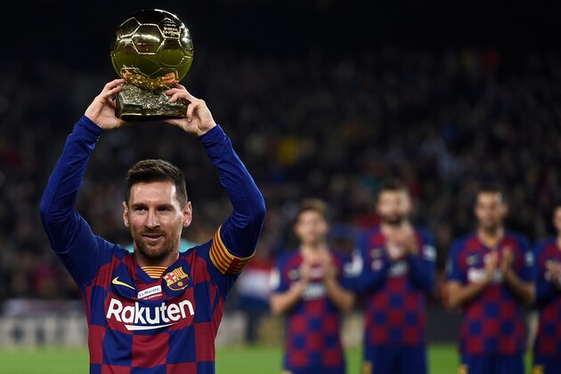 Barcelona's Argentine forward Lionel Messi poses with his sixth Ballon d'Or before the Spanish League football match between FC Barcelona and RCD Mallorca at the Camp Nou stadium in Barcelona on December 7, 2019. (Photo by Josep LAGO / AFP) (Photo by JOSEP LAGO/AFP via Getty Images)