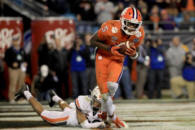 CHARLOTTE, NORTH CAROLINA - DECEMBER 07: Heskin Smith #23 of the Virginia Cavaliers watches as Tee Higgins #5 of the Clemson Tigers catches a touchdown during the ACC Football Championship game at Bank of America Stadium on December 07, 2019 in Charlotte, North Carolina. (Photo by Streeter Lecka/Getty Images)