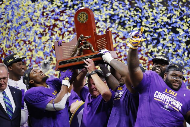 ATLANTA, GEORGIA - DECEMBER 07: The LSU Tigers celebrate with the trophy after defeating the Georgia Bulldogs 37-10 to win the SEC Championship game at Mercedes-Benz Stadium on December 07, 2019 in Atlanta, Georgia. (Photo by Todd Kirkland/Getty Images)
