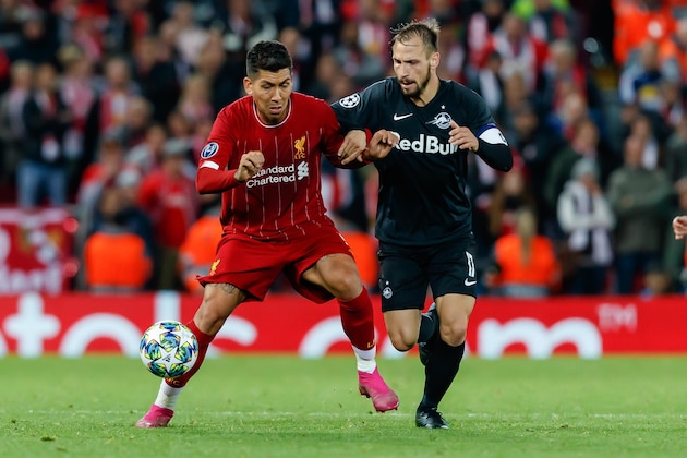 LIVERPOOL, ENGLAND - OCTOBER 02: Roberto Firmino of FC Liverpool and Andreas Ulmer of RB Salzburg im Zweikampf battle for the ball during the UEFA Champions League group E match between Liverpool FC and RB Salzburg at Anfield on October 2, 2019 in Liverpool, United Kingdom. (Photo by TF-Images/Getty Images) LIVERPOOL, ENGLAND - OCTOBER 02: Roberto Firmino of FC Liverpool and Andreas Ulmer of RB Salzburg im Zweikampf battle for the ball during the UEFA Champions League group E match between Liverpool FC and RB Salzburg at Anfield on October 2, 2019 in Liverpool, United Kingdom. (Photo by TF-Images/Getty Images)