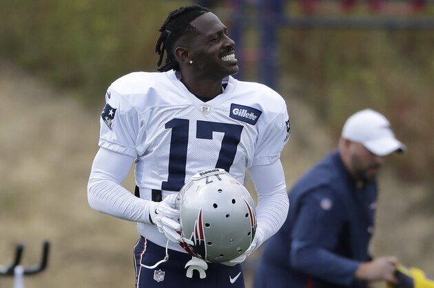 New England Patriots wide receiver Antonio Brown carries his helmet during an NFL football practice, Wednesday, Sept. 18, 2019, in Foxborough, Mass. (AP Photo/Steven Senne)
