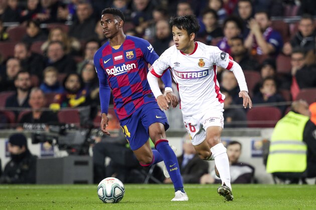 BARCELONA, SPAIN - DECEMBER 7: (L-R) Junior Firpo of FC Barcelona, Takefusa Kubo of Real Mallorca during the La Liga Santander  match between FC Barcelona v Real Mallorca at the Camp Nou on December 7, 2019 in Barcelona Spain (Photo by David S. Bustamante/Soccrates/Getty Images)