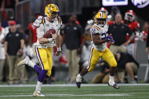 LSU quarterback Joe Burrow (9) runs against Georgia during the first half of the Southeastern Conference championship NCAA college football game, Saturday, Dec. 7, 2019, in Atlanta. (AP Photo/John Bazemore)