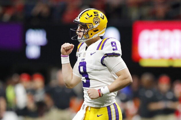 ATLANTA, GEORGIA - DECEMBER 07: Joe Burrow #9 of the LSU Tigers celebrates after throwing a touchdown pass to Terrace Marshall Jr. #6 (not pictured) in the third quarter against the Georgia Bulldogs during the SEC Championship game at Mercedes-Benz Stadium on December 07, 2019 in Atlanta, Georgia. (Photo by Kevin C. Cox/Getty Images)