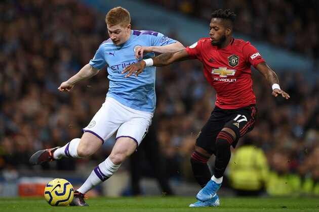 Manchester City's Belgian midfielder Kevin De Bruyne (L) vies with Manchester United's Brazilian midfielder Fred (R) during the English Premier League football match between Manchester City and Manchester United at the Etihad Stadium in Manchester, north west England, on December 7, 2019. (Photo by Oli SCARFF / AFP) / RESTRICTED TO EDITORIAL USE. No use with unauthorized audio, video, data, fixture lists, club/league logos or 'live' services. Online in-match use limited to 120 images. An additional 40 images may be used in extra time. No video emulation. Social media in-match use limited to 120 images. An additional 40 images may be used in extra time. No use in betting publications, games or single club/league/player publications. /  (Photo by OLI SCARFF/AFP via Getty Images)