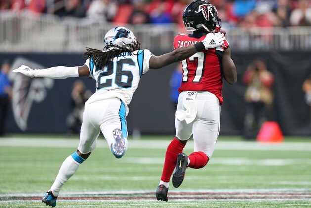ATLANTA, GA - DECEMBER 8: Olamide Zaccheaus #17 of the Atlanta Falcons makes a reception for a touchdown in front of defender Donte Jackson #26 of the Carolina Panthers during the second half of the game at Mercedes-Benz Stadium on December 8, 2019 in Atlanta, Georgia.  (Photo by Carmen Mandato/Getty Images)
