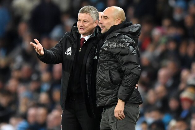 MANCHESTER, ENGLAND - DECEMBER 07: Ole Gunnar Solskjaer, Manager of Manchester United speaks with Pep Guardiola, Manager of Manchester City during the Premier League match between Manchester City and Manchester United at Etihad Stadium on December 07, 2019 in Manchester, United Kingdom. (Photo by Michael Regan/Getty Images)
