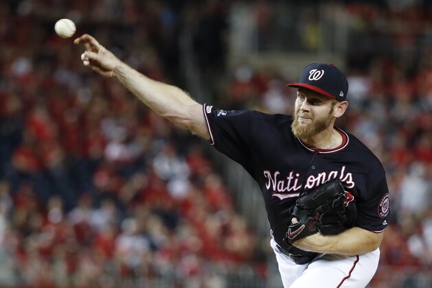 Washington Nationals starting pitcher Stephen Strasburg throws during the first inning of Game 3 of the baseball National League Championship Series against the St. Louis Cardinals Monday, Oct. 14, 2019, in Washington. (AP Photo/Jeff Roberson)