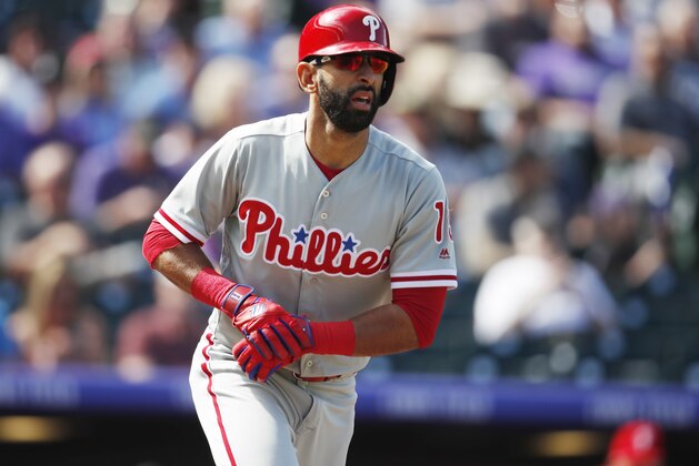 Philadelphia Phillies' Jose Bautista heads to first base after drawing a walk from Colorado Rockies starting pitcher Antonio Senzatela in the first inning of a baseball game Thursday, Sept. 27, 2018, in Denver. (AP Photo/David Zalubowski)